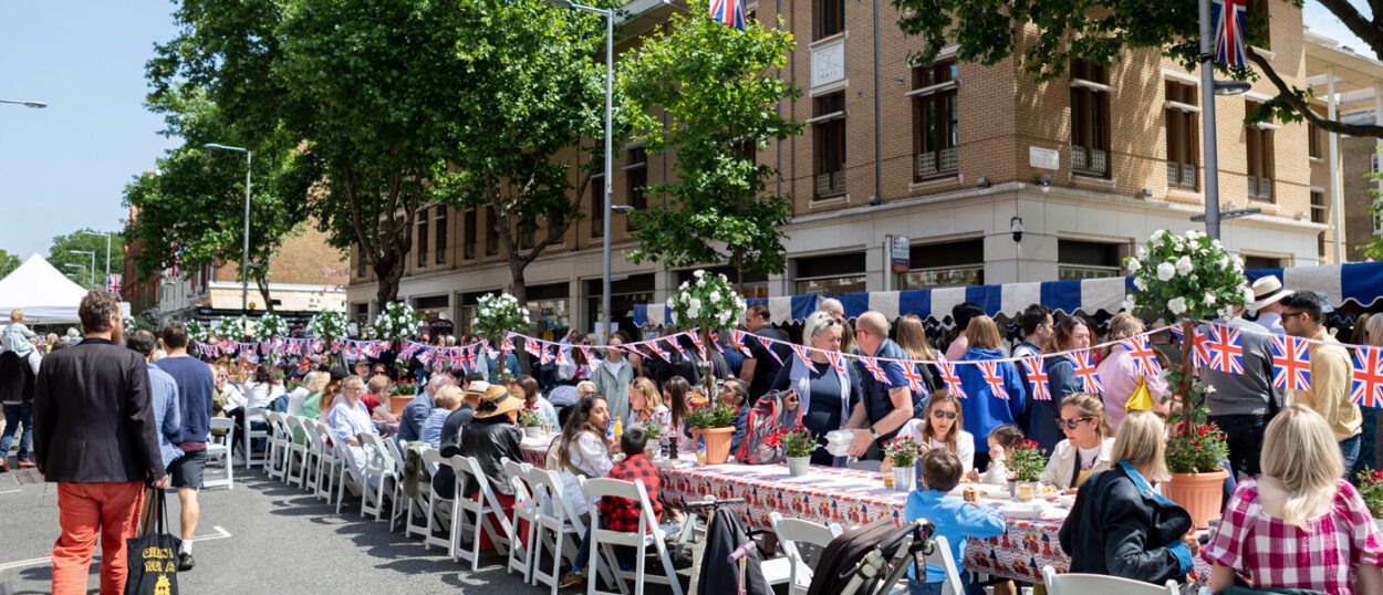 A street party is underway with Union Jack bunting running the length of the table.